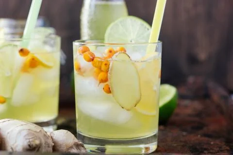 Cold lemonade with ginger, lime and sea buckthorn Stock Photos