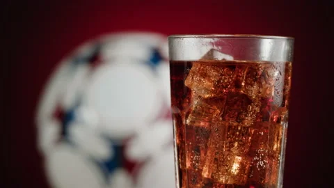 Cold lemonade in glass close-up. Drinks for watching football. Cola with ice Stock Footage 197030355
