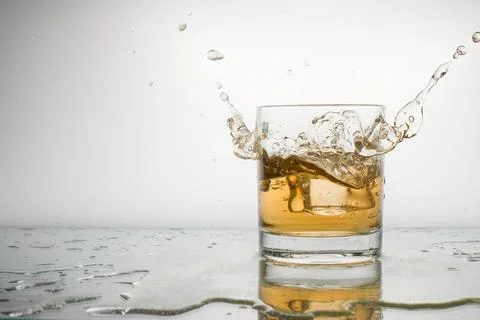Cold lemonade with ice, with spray, with space for writing Stock Photos