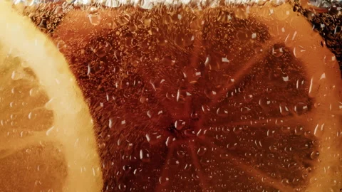 Cold lemonade with lemon in glass close-up. Cola and ice macro shooting texture Stock Footage 198211460