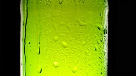 Cold light beer bottle dripping condensate Stock Footage 153607439