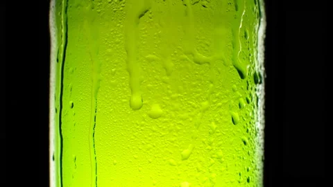 Cold light beer bottle dripping condensate Stock Footage 164437159