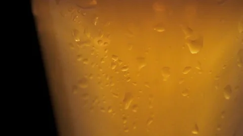 Cold light beer in a glass with drops of water. Stock Footage 90487326