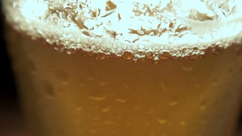 Cold light beer in a glass with drops of water. Stock Footage 90487341
