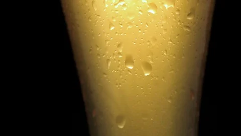 Cold light beer in a glass with drops of water. Stock Footage 90487348