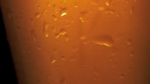 Cold light beer in a glass with drops of water. Stock Footage 90487350