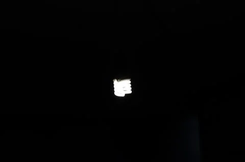 Cold light bulb in the dark Stock Photos