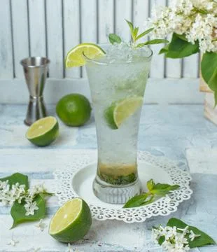 Cold lime cocktail on the table Stock Photos