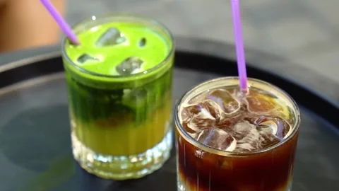 Cold matcha with ice on the coffee table. Stock Footage 278884646