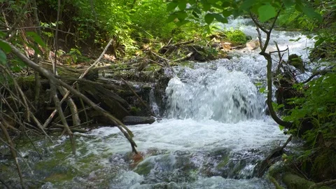 Cold mountain river flows among stones. cold and clear, turquoise river . Video stock 123469684