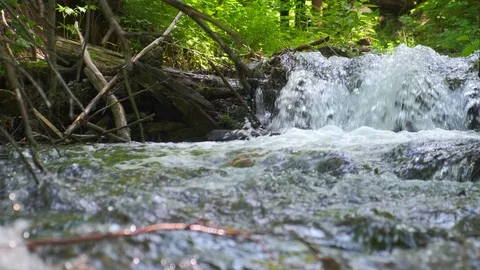 Cold mountain river flows among stones. cold and clear, turquoise river . Video stock 123845590