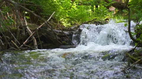 Cold mountain river flows among stones. cold and clear, turquoise river . Video stock 124713170