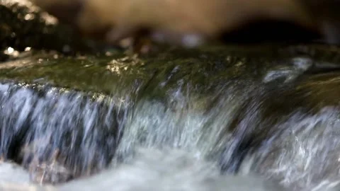 A cold mountain stream flows Video stock 158614220