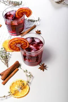 Cold mulled wine with cherry and bloody orange. Alcoholic beverage still life Stock Photos
