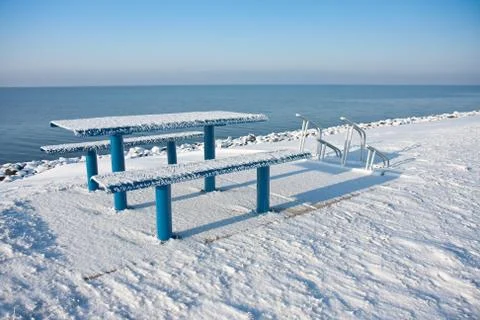 Cold picnic table in wintertime Stock Photos