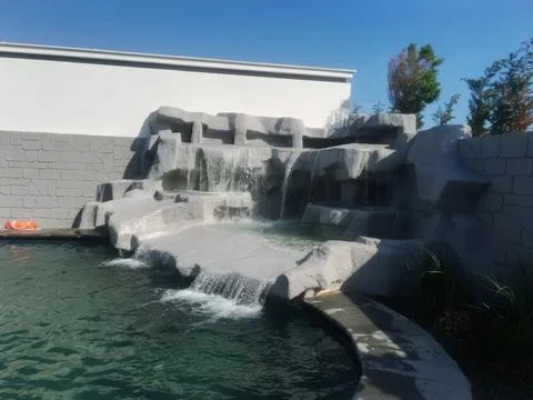Cold pool with a stone waterfall Stock-Fotos