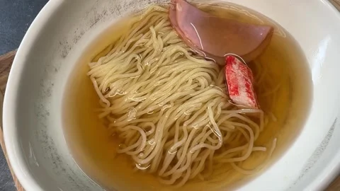 Cold Ramen Topped with Karaage Fried Chicken and Tomato (Hiyashi Chuka), Japan Stock Footage 345709797