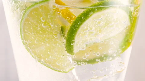 Cold refreshing citron tonic, lemonade or cocktail with ice cubes and fresh mint Stock Footage 167785492