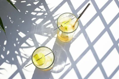 Cold refreshing cocktail of melon with ice and lime slices. Summer cocktails and Stock Photos