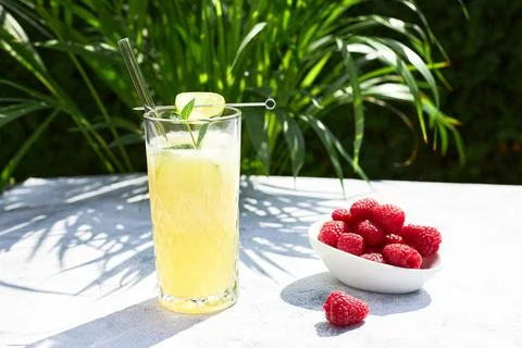 Cold refreshing cocktail of melon with ice and lime slices. Summer cocktails and Stock Photos