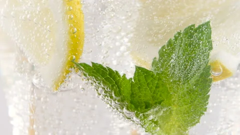 Cold refreshing lemonade or mojito alcoholic cocktail with ice cubes and fresh Stock Footage 155509721