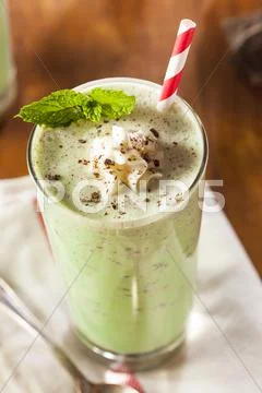 Cold refreshing mint chocolate chip milkshake Stock Photos