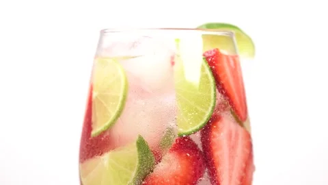 Cold refreshing strawberry and lime lemonade or mojito cocktail with ice cu.. Stock Footage 276893475