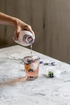 Cold refreshing tea with blueberry, lime and lavender on a hot summer day Stock Photos