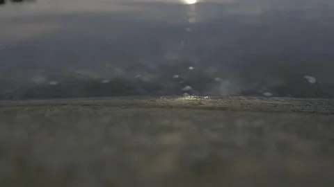 Cold sea and sunlight reflections on a rock bed Stock Footage 141846749