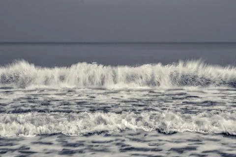 Cold sea wave. Selective focus. Long exposure. black white sea surface for Stock Photos