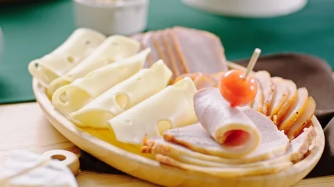 Cold Snacks Board of Various Kinds Of CheeseWith Meats, Salads, Olives Stock Footage 124043372