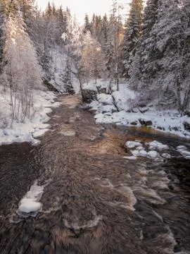 The cold snow winter river in evening light Stock Photos