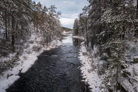 The cold snow winter river in evening light Stock Photos