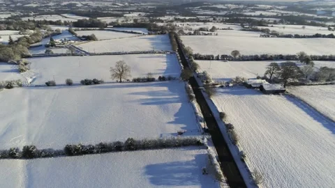 Cold snowy winter British patchwork farmland countryside rural scene Video stock 146523160