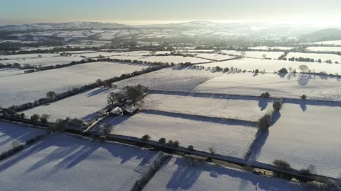 Cold snowy winter British patchwork farmland countryside rural scene Video stock 146523916