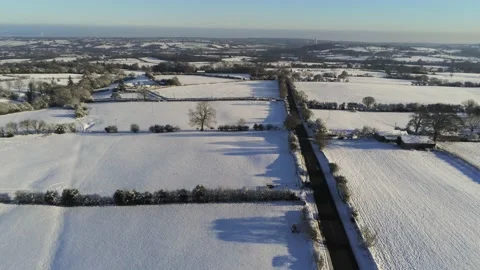 Cold snowy winter British patchwork farmland countryside rural scene Video stock 146524029