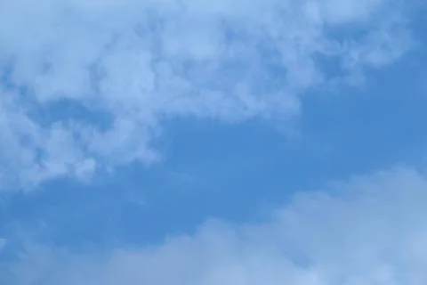 Cold spring clouds on a heavy blue sky Stock Photos