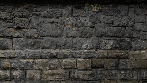 Cold stone wall aged building front side wallpaper panorama textured surface  Foto stock