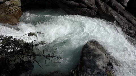 A cold stream flowing in full natural force in the High Tatras in Slovakia Stock Footage 211819725