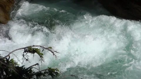 A cold stream flowing in full natural force in the High Tatras in Slovakia Stock Footage 211820747