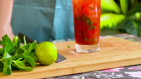 Cold summer strawberry cocktail mojito, margarita, daiquiri. Making of fresh gla Stock Footage 238670341