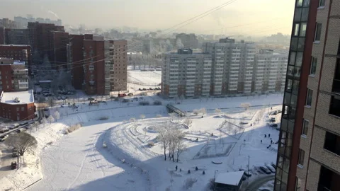 Cold sunny morning with snow-covered frozen river and court, Russia Stock Footage 166200529