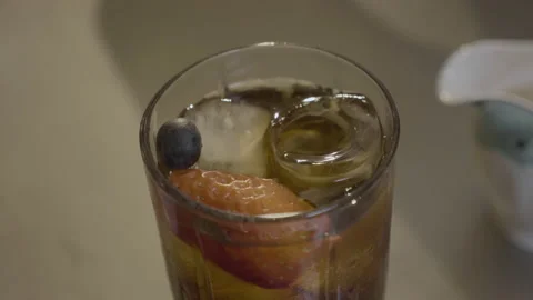 Cold tea with ice and fruit 動画素材 220852948