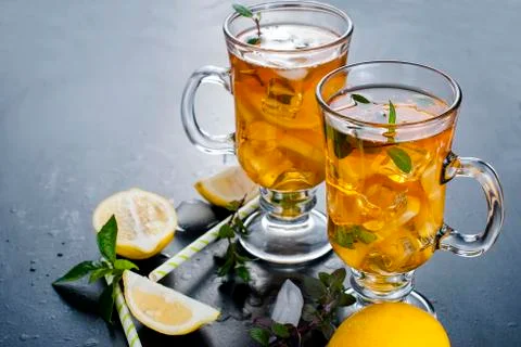 Cold tea with lemon, mint and ice 스톡 사진