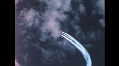 Cold War era American combat jet airplanes inflight at high altitude with trails Stock Footage 197038641