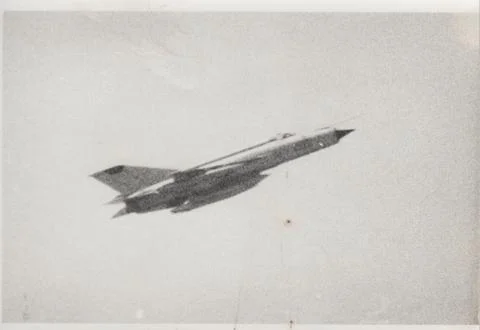 Cold War era soviet fighter jet in flight with drop tank (BW negative). 스톡 사진