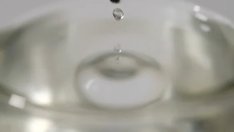 Cold water drop into drinking glass in slow motion Stock Footage 113594210