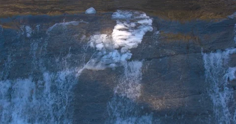 Cold Water Flowing Down an Icy River Stock Footage 100686164