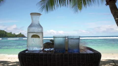 Cold water in a misted jug, filled with ice and lemon Stock Footage 154807436