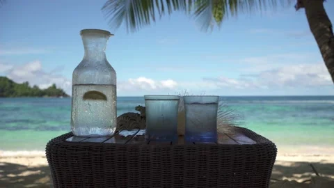 Cold water in a misted jug, filled with ice and lemon Stock Footage 154807444